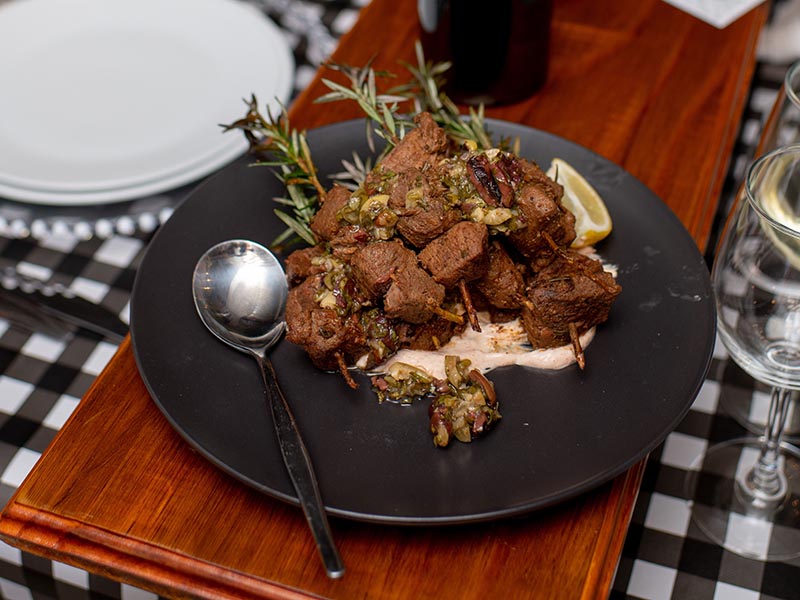 Lamb served at recent Chefs table large green farm tractor